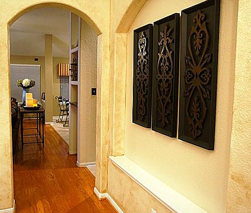 Lots of arches throughout the home. Nice view of the art niche with custom faux paint finishes.