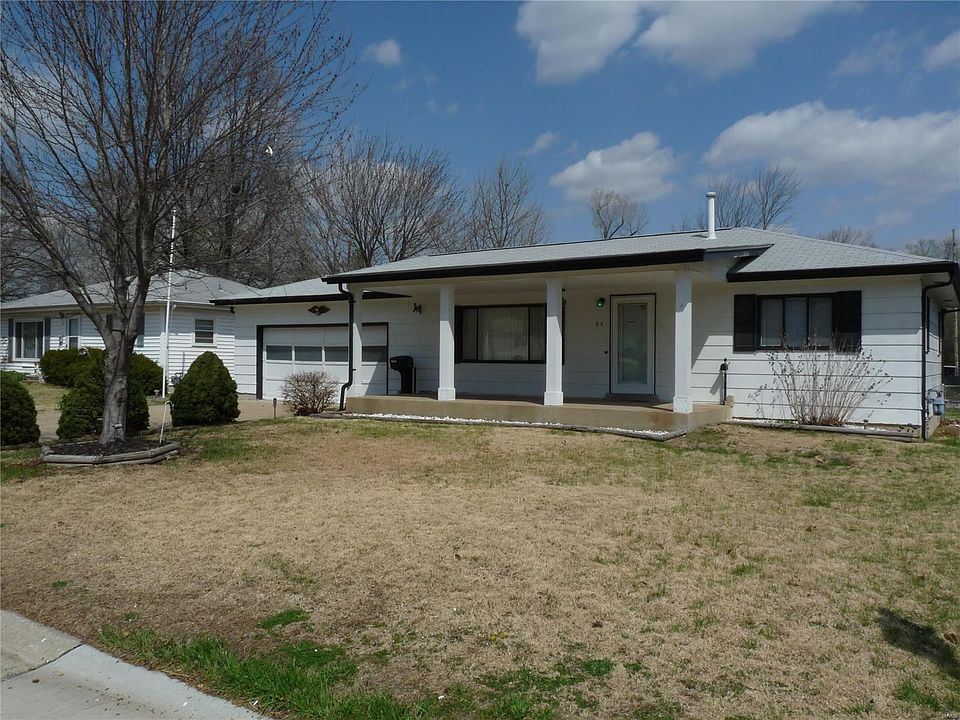 Oversized 2 car garage with workshop & 220 service, large covered front porch & fenced yard.