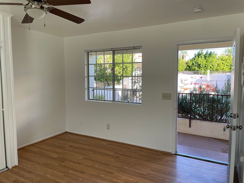 Studio Apartment main living space includes a large closet and views to the pool and mountains
