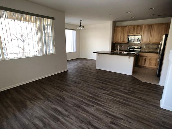 Newer LVP flooring in living room and dining room