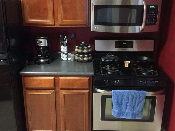 Stainless Steel vent-a-hood microwave above gas stove