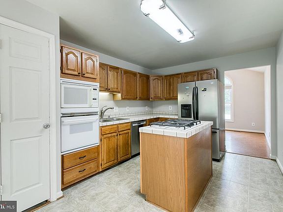 Kitchen w/ Island, Microwave, SS Fridge &  DW