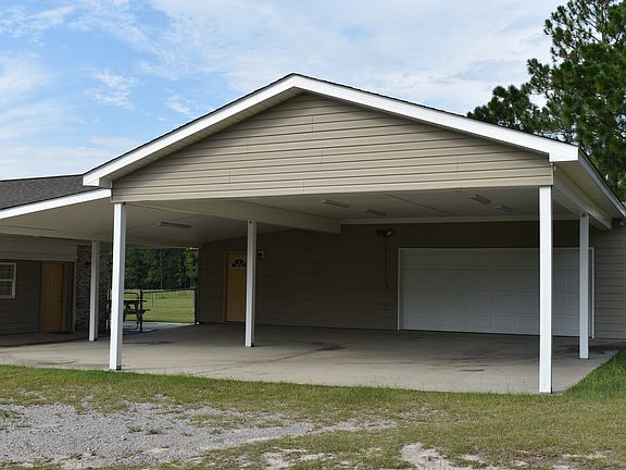Attached car port and garage