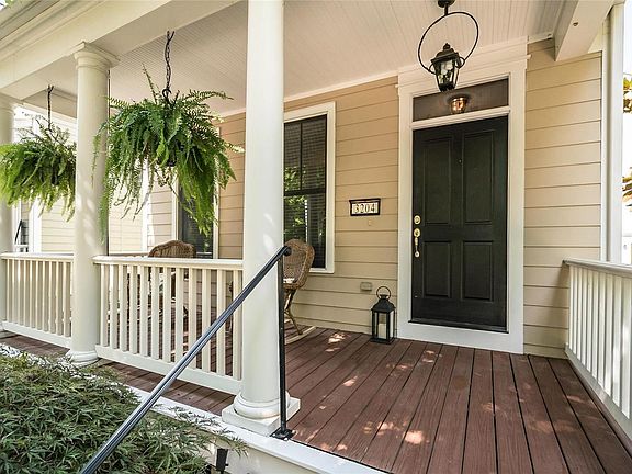The mature trees offer plenty of shade to relax on the porch!