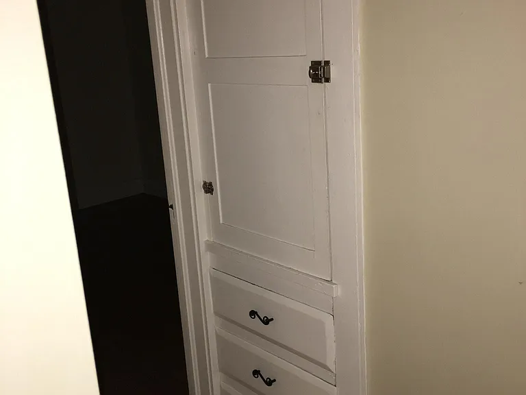 Hallway built in linen cabinets