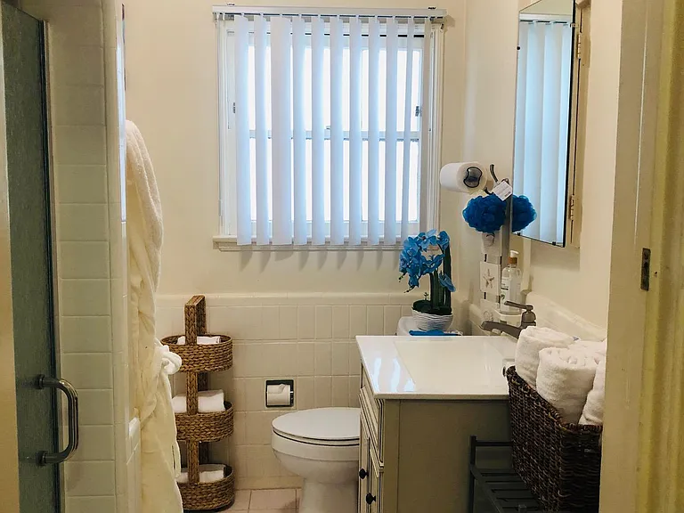 Large bright Bathroom with separate tub and shower.