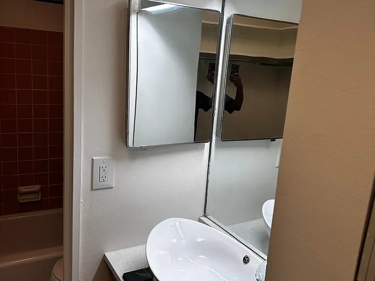 Privacy maintained by separate room for Tub-shower bath and dual flush toilet.