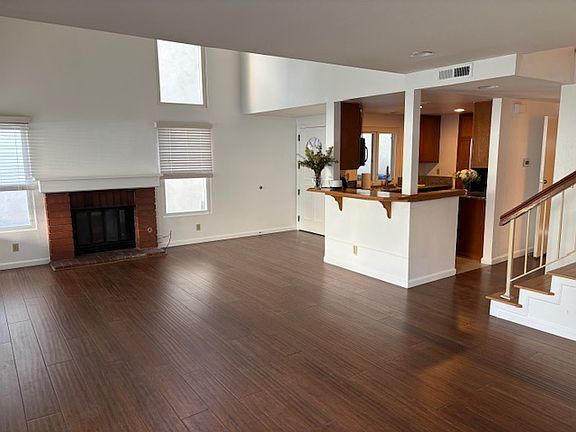 An open concept living and dinning room with fireplace!