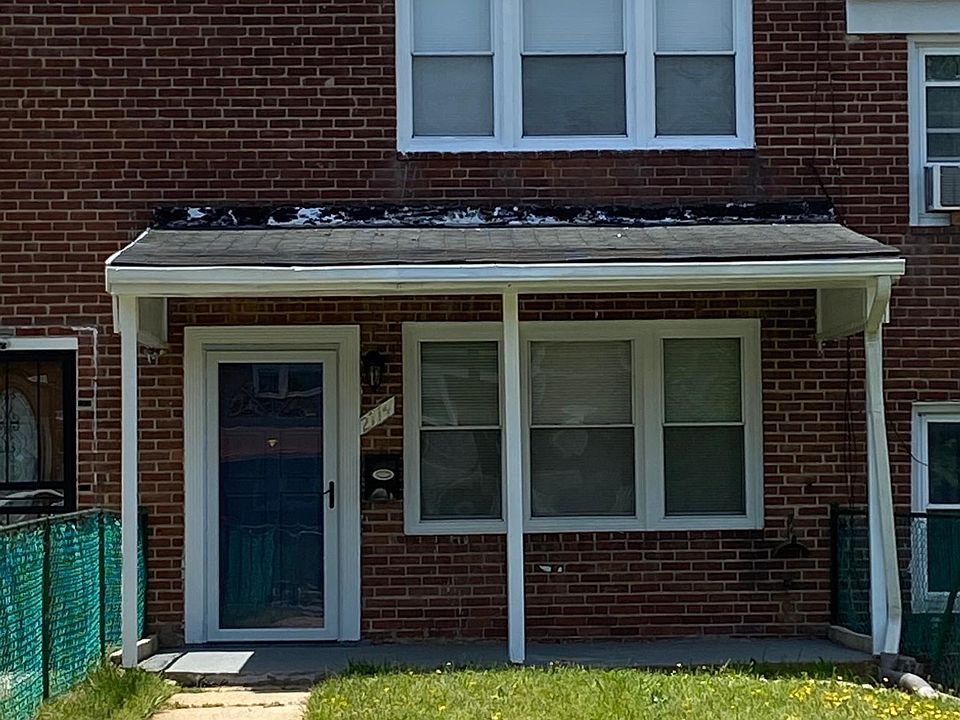 Front Entrance/covered porch and fenced yard.
