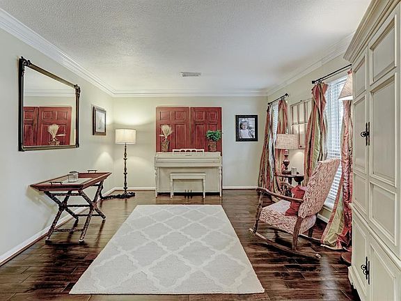 Formal living room greets you to the right as you enter the home. One of three living areas!