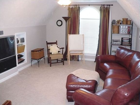 Large bonus room features built-ins and surround sound wiring.