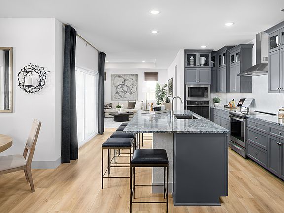 Kitchen with wood flooring and gorgeous cabinets