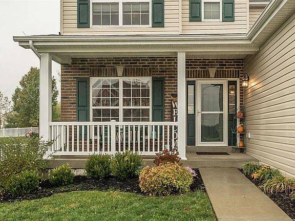 The front porch is a welcoming feature for guests and a great place to relax away from the sun.  The owners added the Storm.Screen Door to the home.