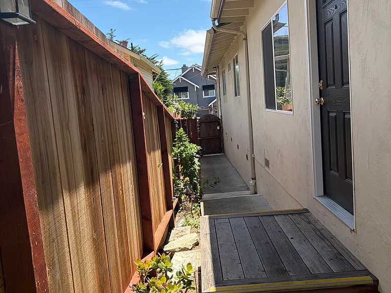 Side yard private entry.