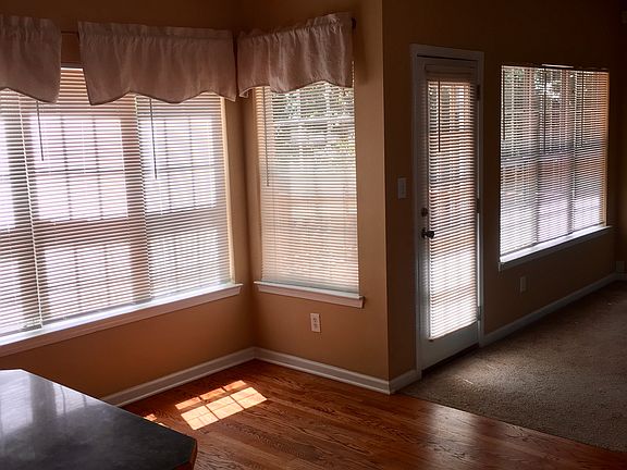 Beautiful back of house bay of windows with afternoon sun.