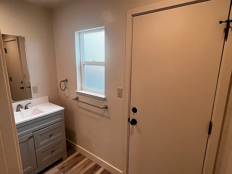 Exterior door from bathroom to side of unit