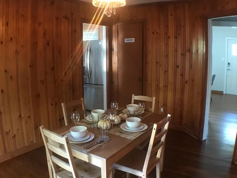 Dining room with knotty wood pine paneling
