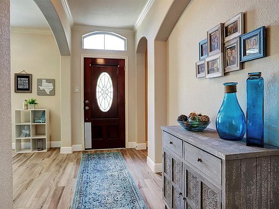 Arched entries and neutral colors throughout the home.