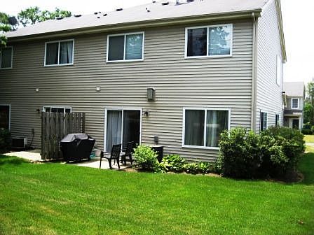 Sliding door from dining area walk out to patio. Own the land (rare for TH)
