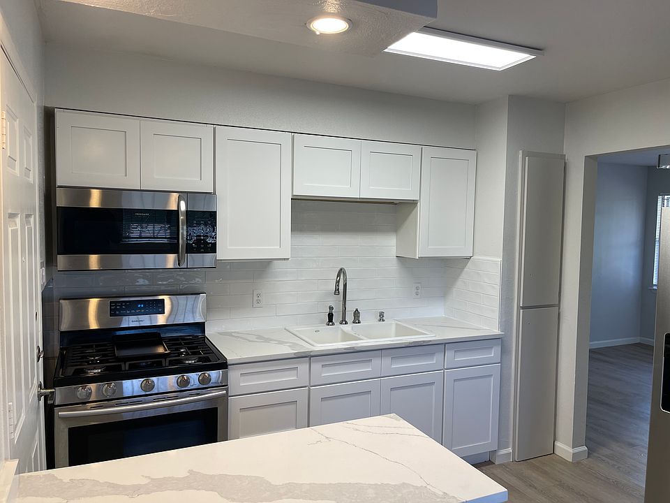 Kitchen with Gas Range and Microwave hood vent