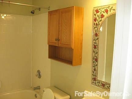 Bath off Master Bedroom (2) : Towel hooks on the opposite wall; spacious considering the size.