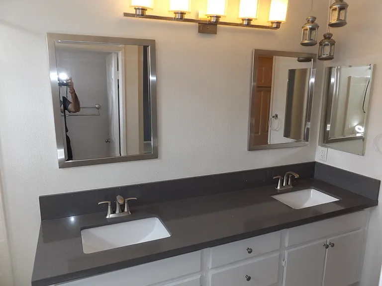 Second bathroom with dual sinks which also has a bathtub