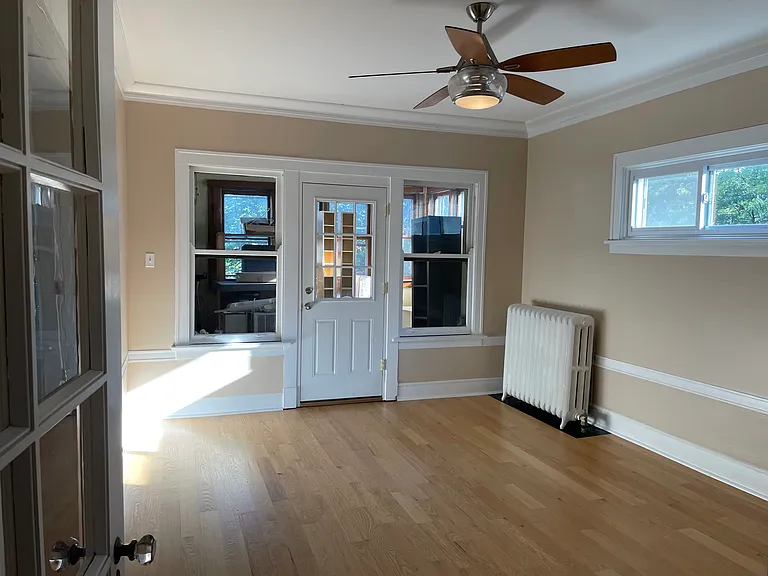 Dining room off the kitchen with back sunroom