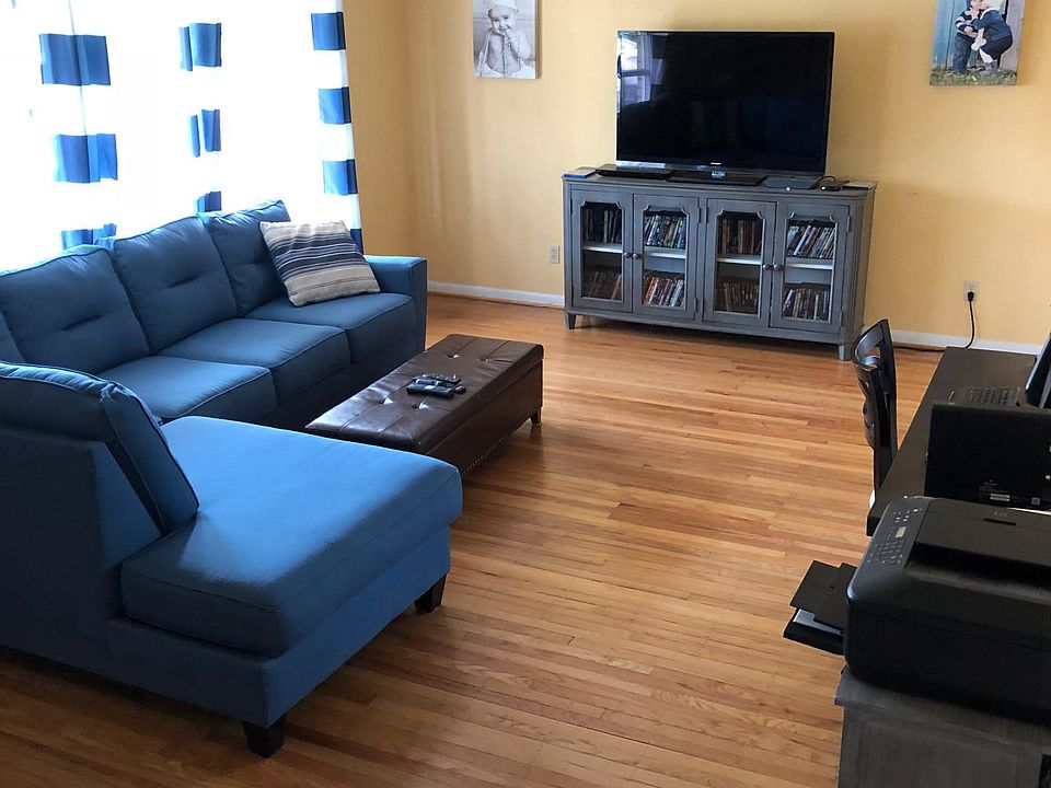 Large living room with sloped high ceilings