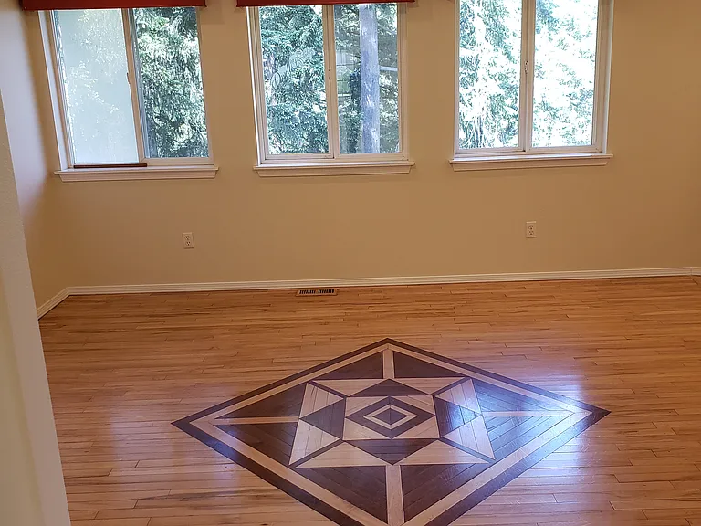 family room with custom floor inlay