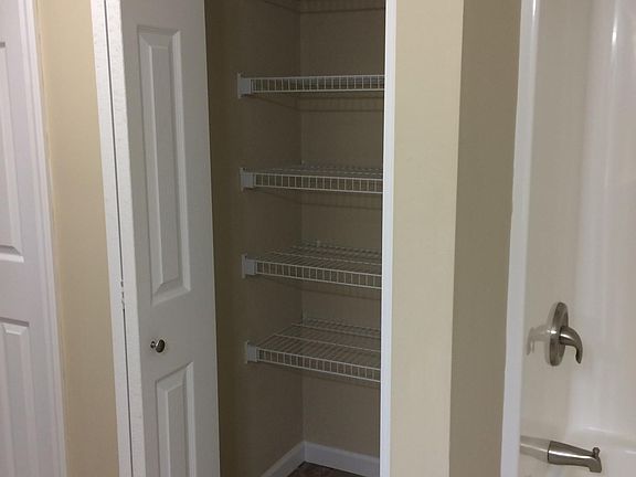 Closet in bathroom area. Roomy bathroom.