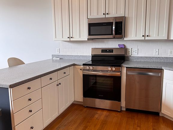 Talk about cabinet space! Flatware, plates and bowls included.