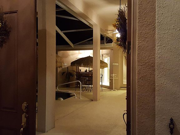 Looking inside the front doors onto the pool patio.