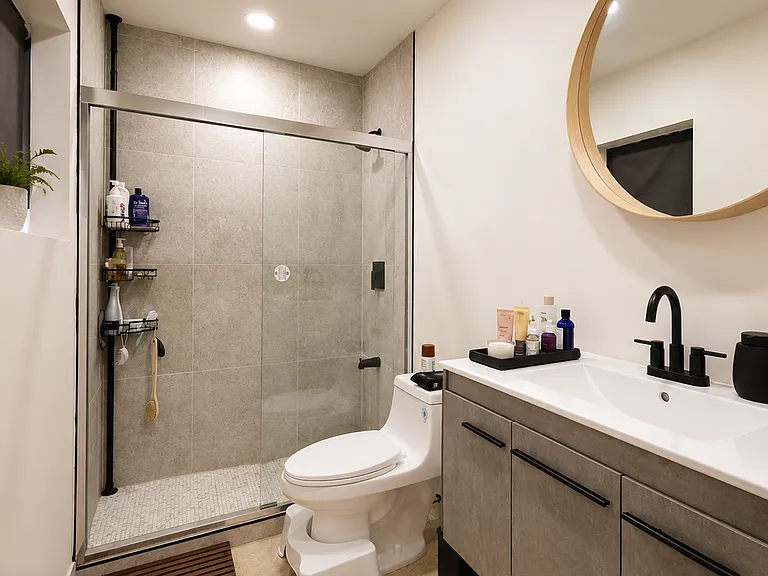 Guest Bathroom
Updated full bathroom with modern fixtures, vanity, and shower/tub combination.