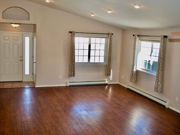 Front door, coat closet, and living room.