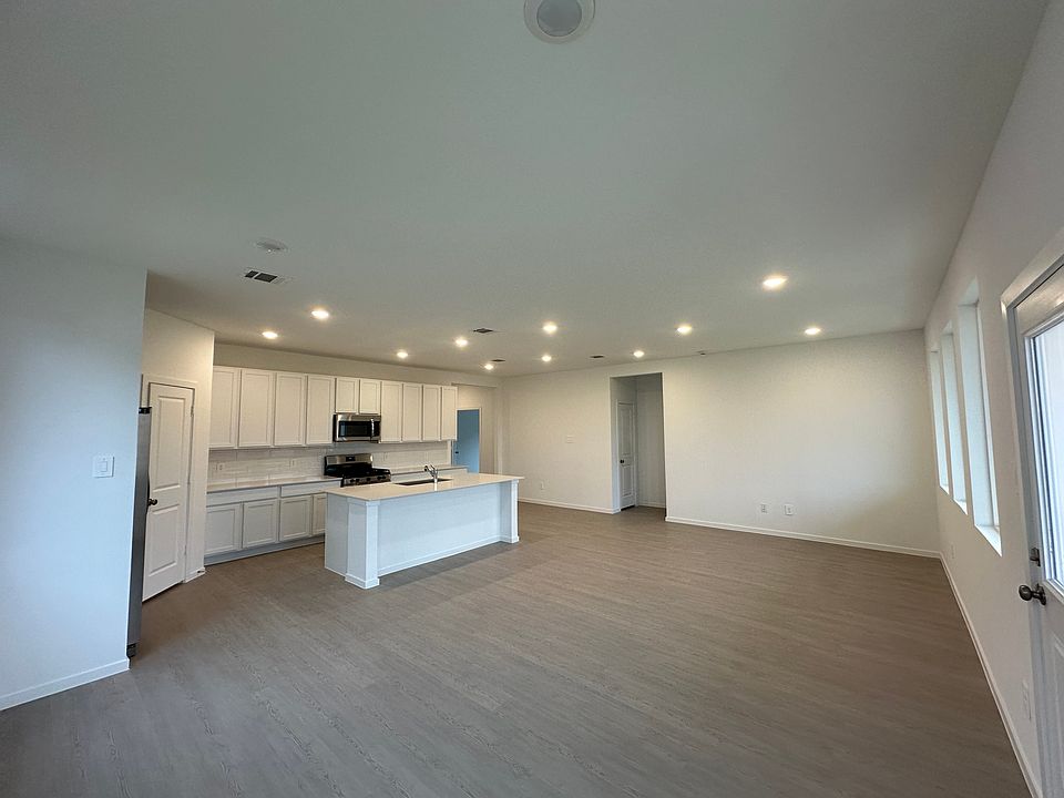 View from the corner showing the open kitchen with living and dining area.