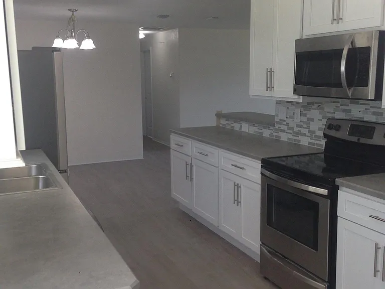 looking from kitchen nook to dinning area /hall to bedrooms