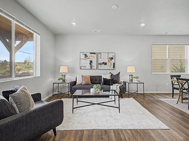 Spacious living room with multiple bright windows