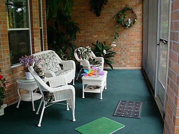 Large screened in patio with plenty of room to entertain or just to relax.