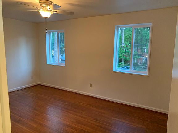 Master bedroom with three windows and big closet space