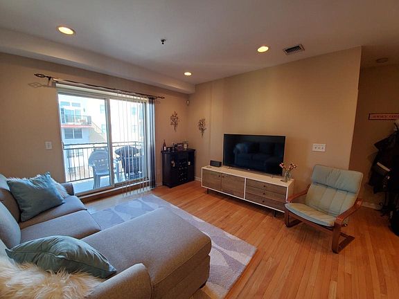 Inviting Living room area with private patio facing West.