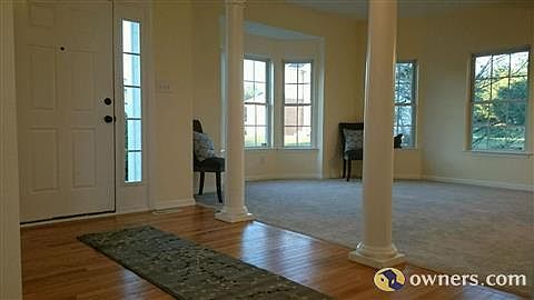 Grand entrance with beautiful columned accents.