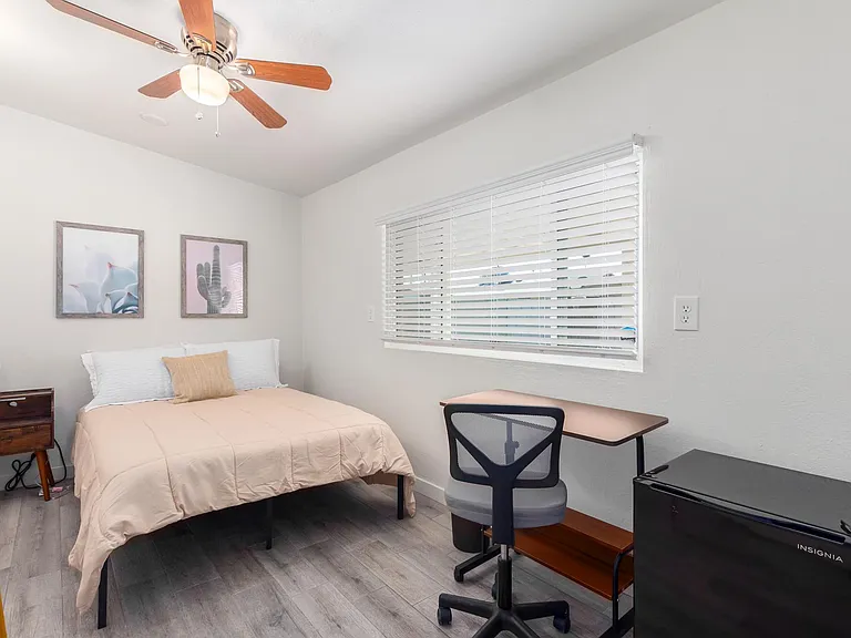 Room 7- ceiling fan, desk chair and mini fridge