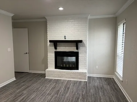 View of master bedroom with fireplace.