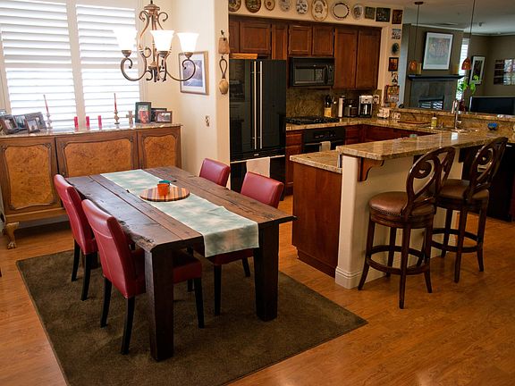 Kitchen table will be replaced by round oak table and four chairs. Bar stools will be replaced by three birch stools.