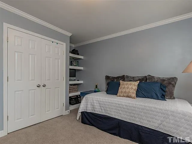 Front bedroom with full closet and built-in shelves*