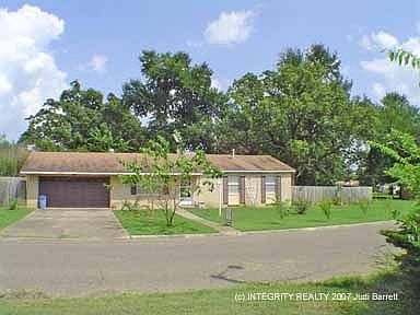 Front of the home - Notice the shrubs beautiful flowering trees!