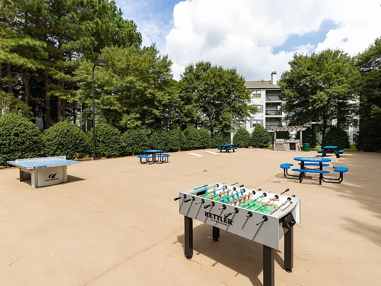 Sport court with foosball table, board games and grilling area