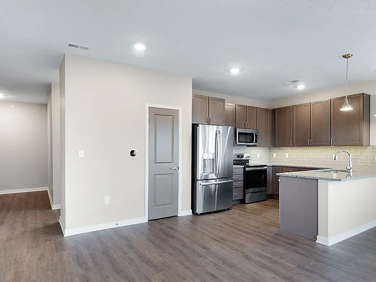 Enjoy a roomy kitchen with a large pantry, perfect for keeping all your essentials organized and within reach.