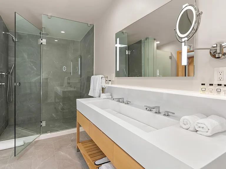 High quality finishes include include Toto Neorest 700 Dual Flush Bidet and a glass framed rain shower.