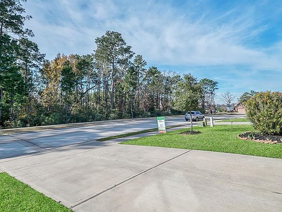 NO NEIGHBORS ACROSS THE STREET, WALK DOWN STREET TO LAKE CONROE. NO FLOODING DURING HARVEY.